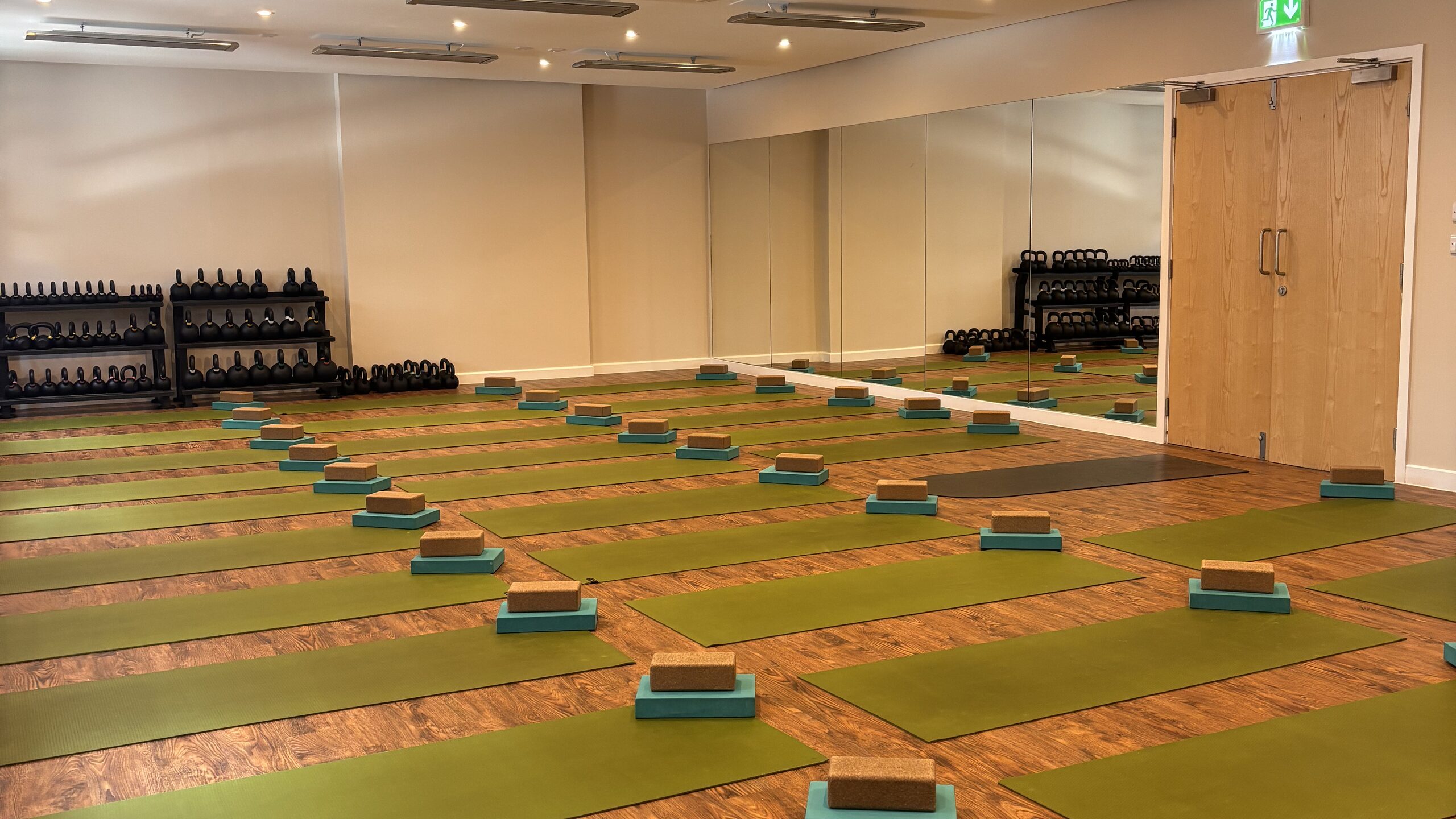 The Hot Studio at Deansgate Haus, mats and blocks laid out for class