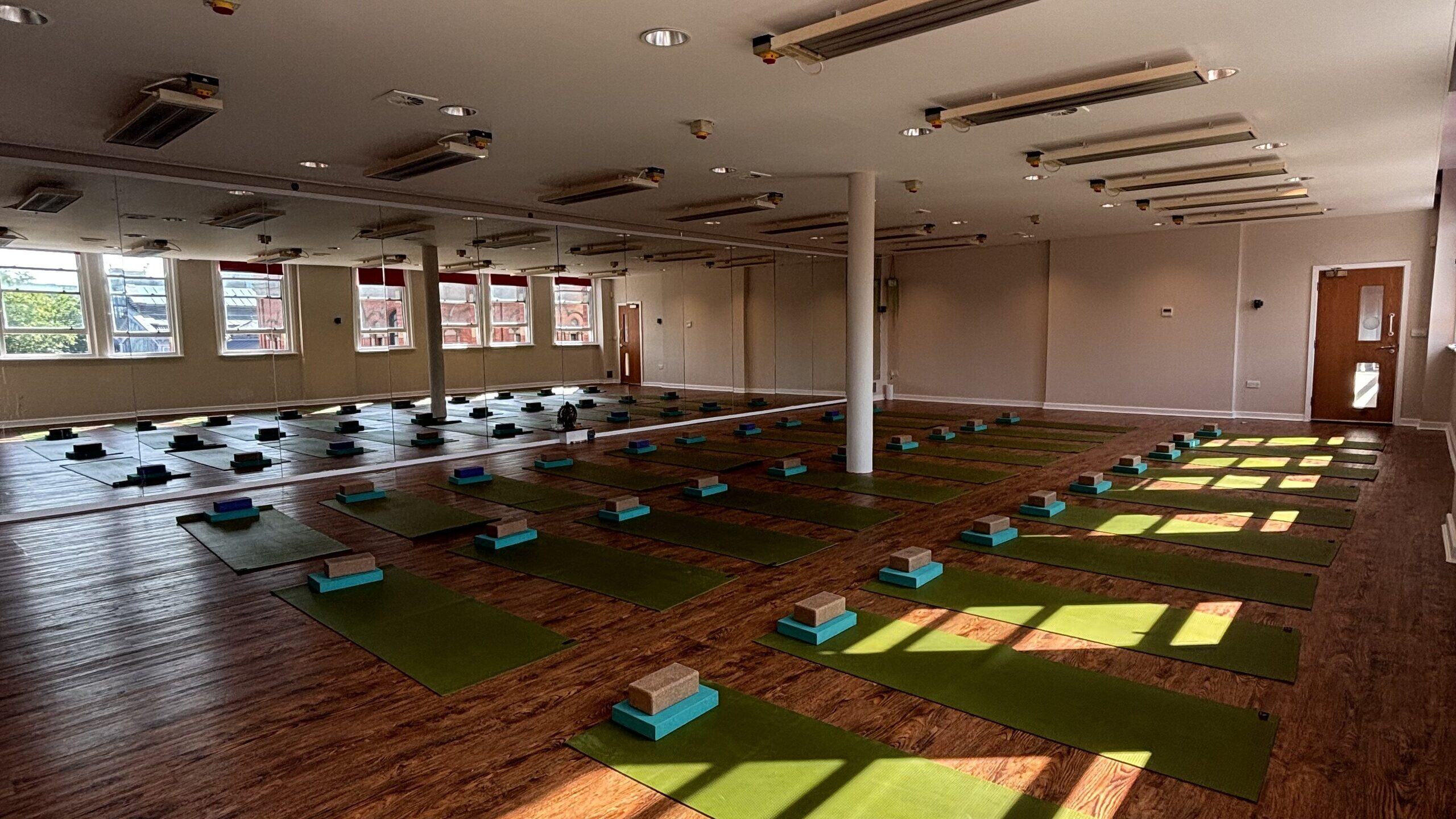 The Hot Studio at Deansgate Haus, sunlight across mats and blocks