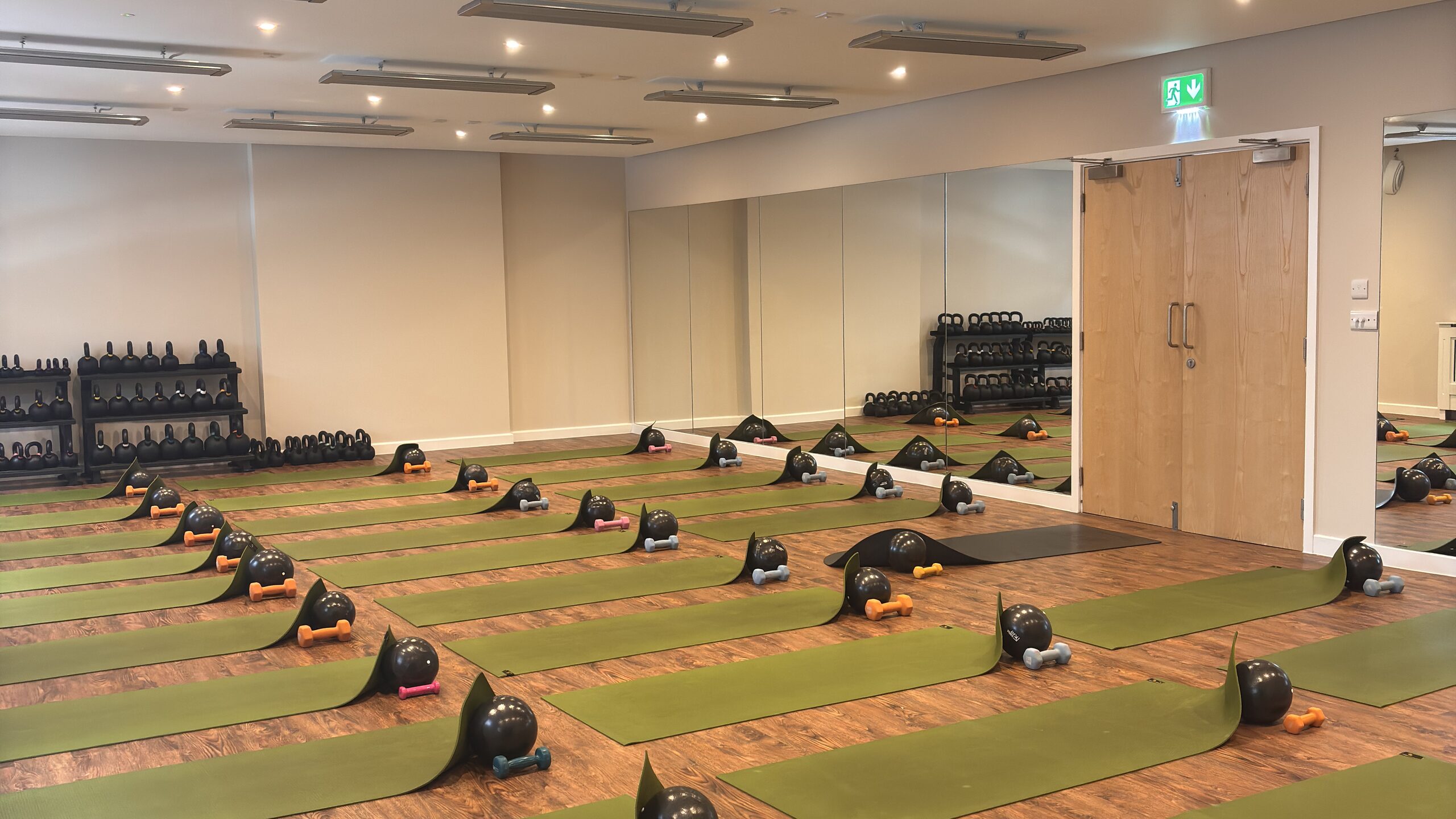 The Hot Studio at Deansgate Haus, mats, balls and weights set out for class
